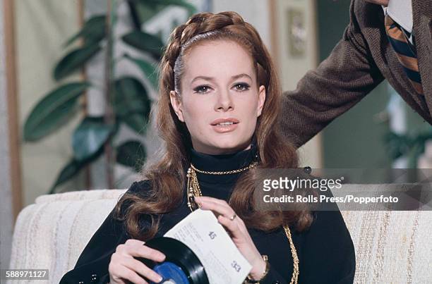 italian-actress-luciana-paluzzi-pictured-holding-a-45rpm-single-record-in-a-scene-from-the.jpg