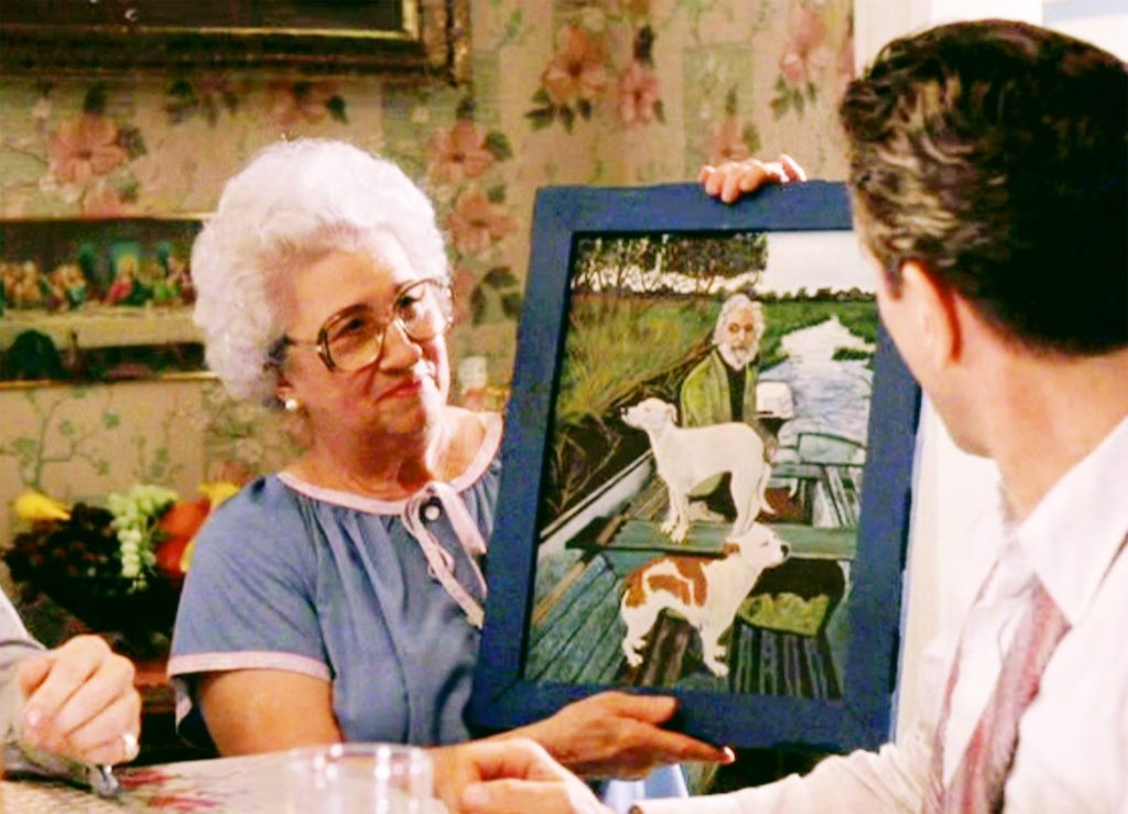 tommys-mom-holding-the-painting-at-table-1024x739.jpg